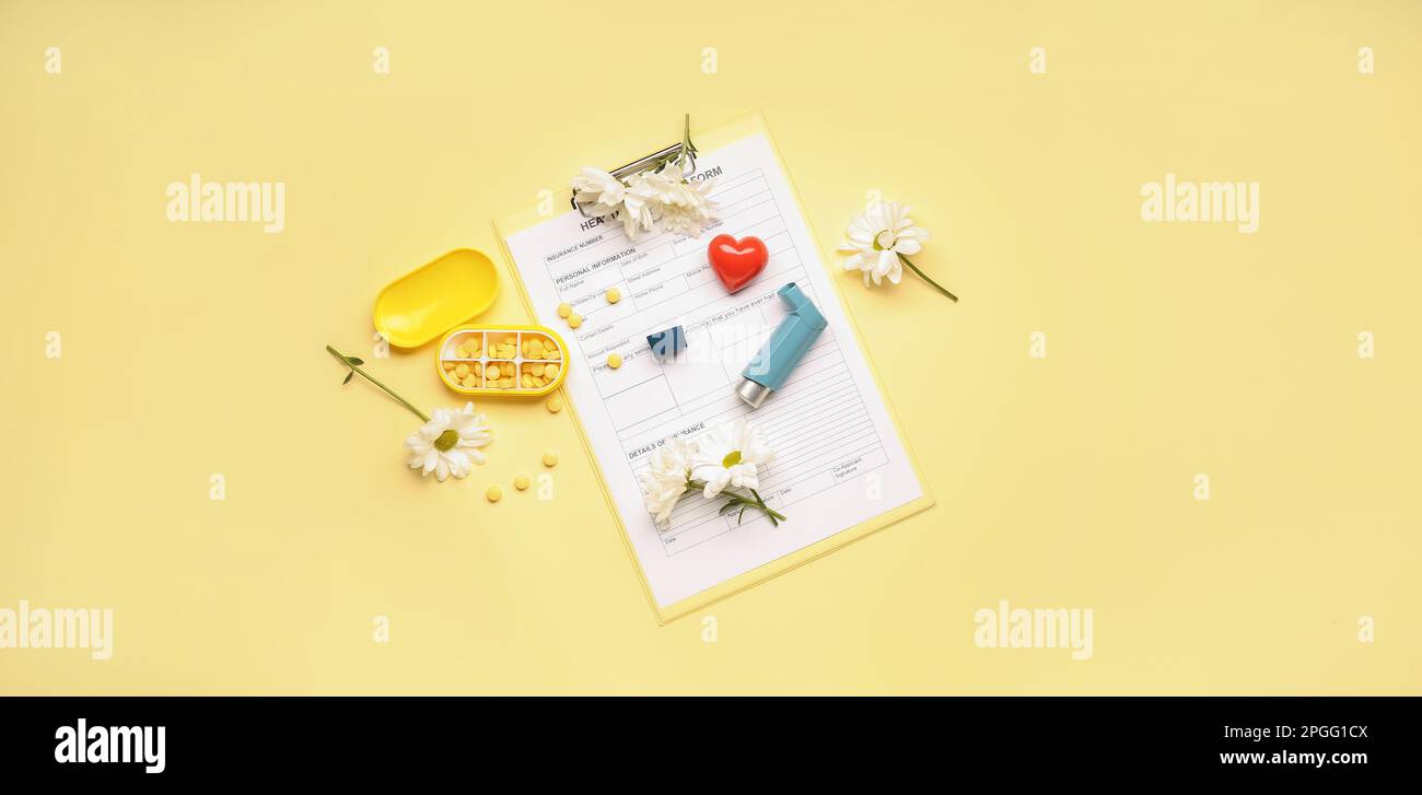 Inhaler, flowers, pills and laboratory test result on yellow background