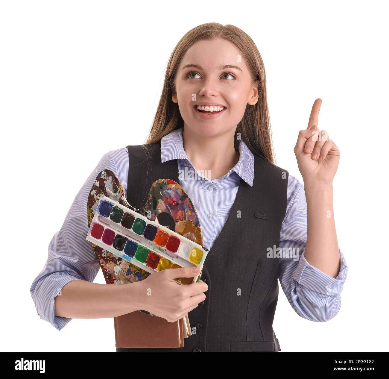 Drawing teacher with paint palette and books pointing at something on white background Stock