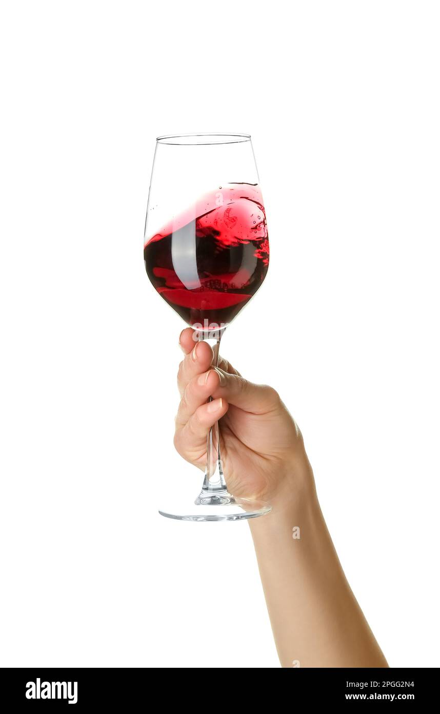 Female hand holding glass of red wine isolated on white background