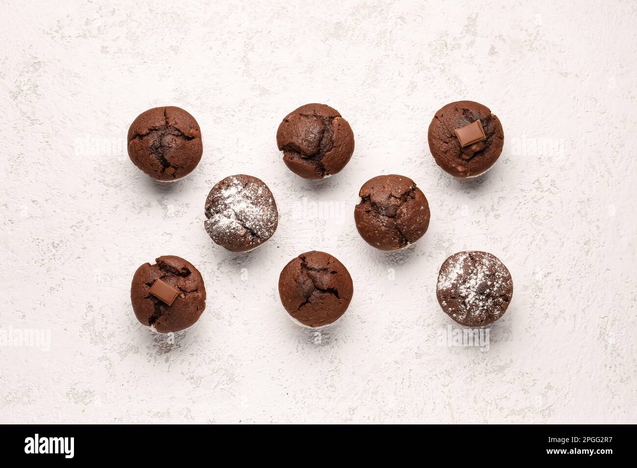 Tasty chocolate cupcakes on light background Stock Photo