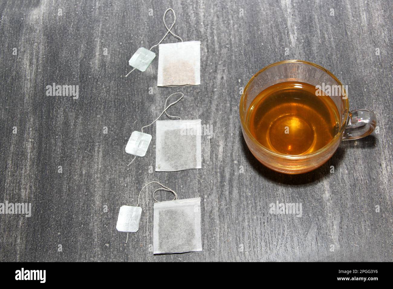 Tools for preparing and serving herbal tea: glass cup, infuser, sachets ...