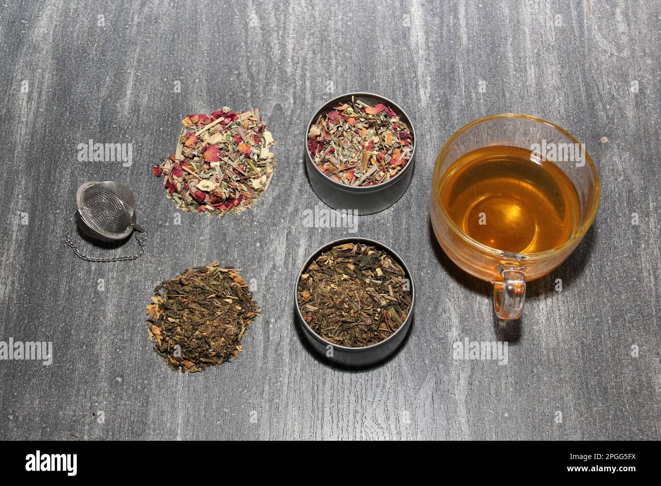 Tools for the preparation of herbal tea: glass cup, infuser, spoon ...