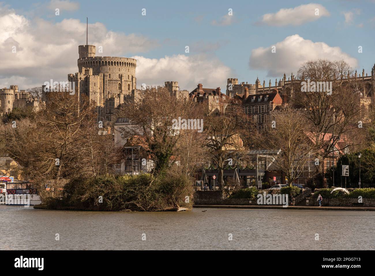 Windsor, Berkshire, England, UK. 2023. View of The Round Tower Windsor Castle across the River Thames in wintertime. Stock Photo