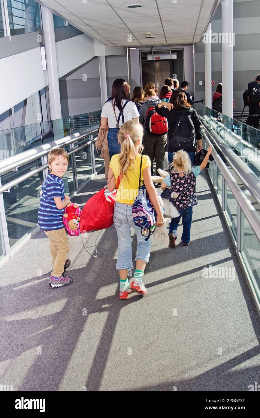 children hurry to board a plane Stock Photo Alamy