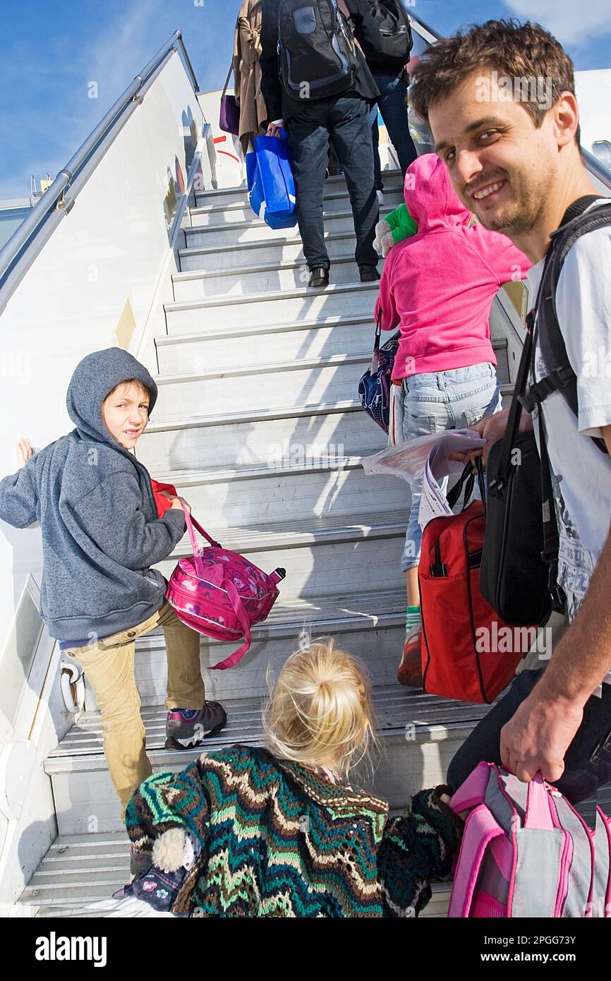 Happy passengers plane hi-res stock photography and images - Alamy