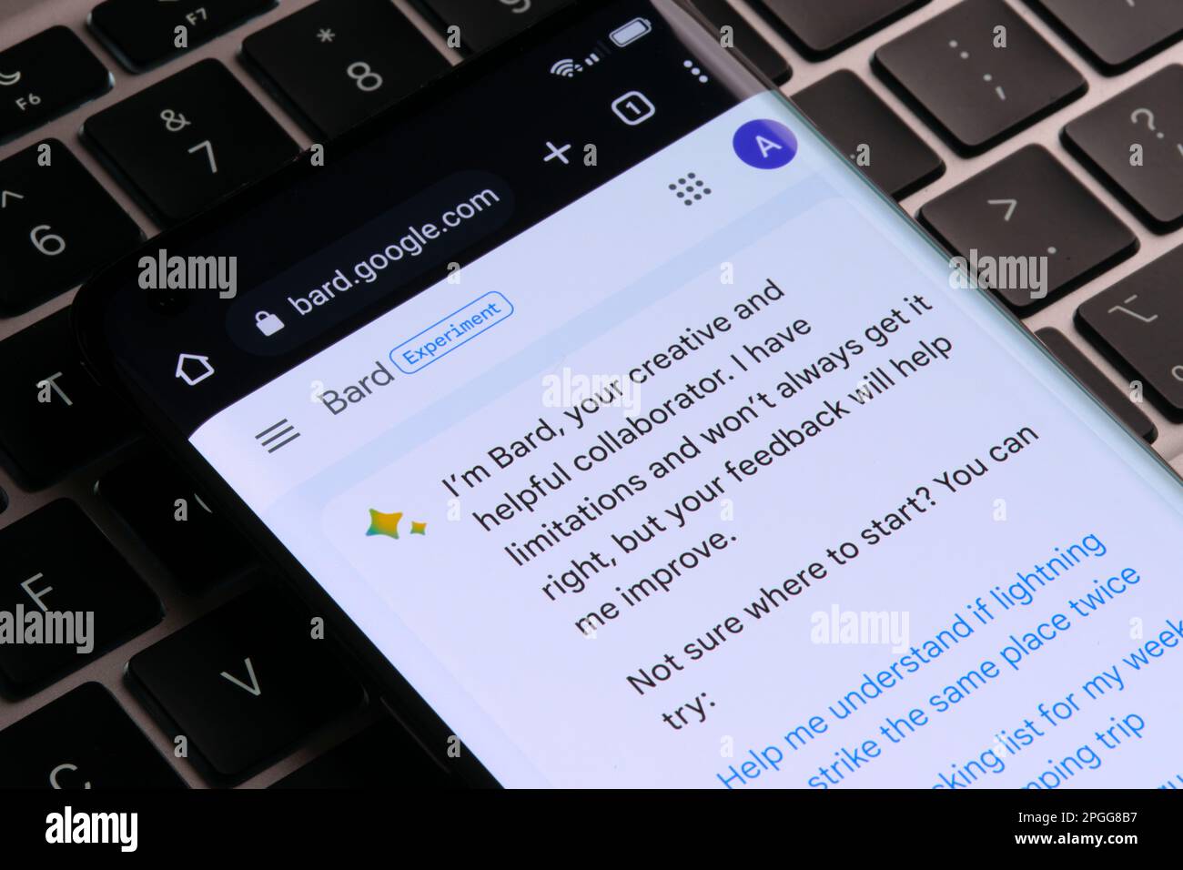 Google Bard AI chatbot. Real example of chat bot seen on the screen of smartphone which placed on keyboard. Stafford, United Kingdom, March 22, 2023 Stock Photo