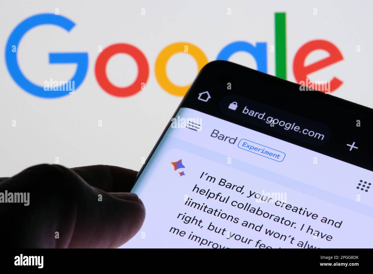 Google Bard AI chatbot. Real example of chat bot seen on the screen of device and Google logo on background. Stafford, United Kingdom, March 22, 2023 Stock Photo