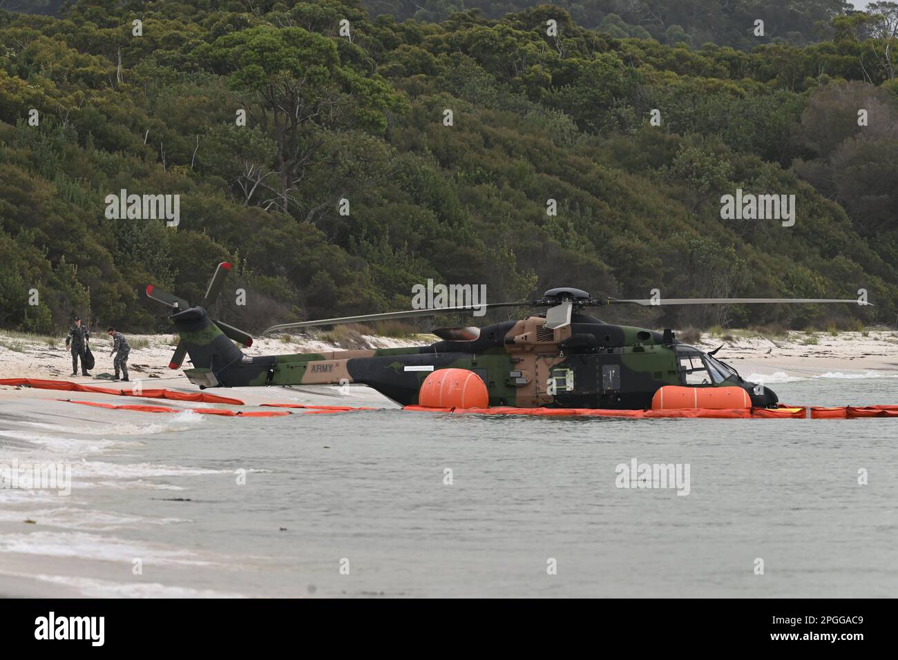 Naval personel at the scene where an Army MRH90 Taipan multirole