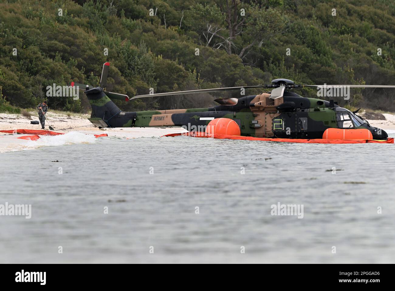 Naval personel at the scene where an Army MRH90 Taipan multirole