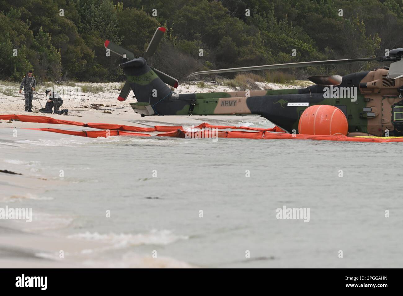Naval personel at the scene where an Army MRH90 Taipan multirole