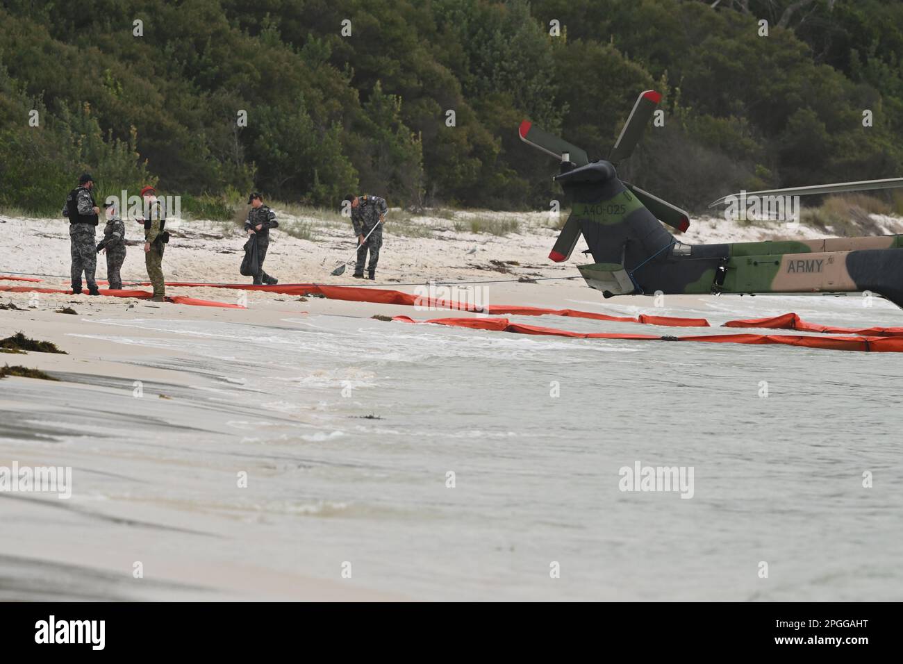 Naval personel at the scene where an Army MRH90 Taipan multirole