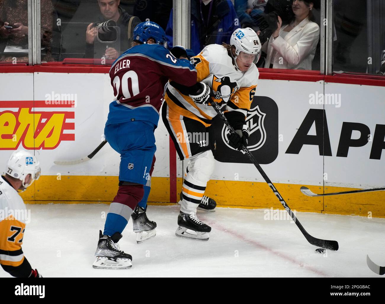 Colorado Avalanche center Lars Eller, left, checks Pittsburgh Penguins