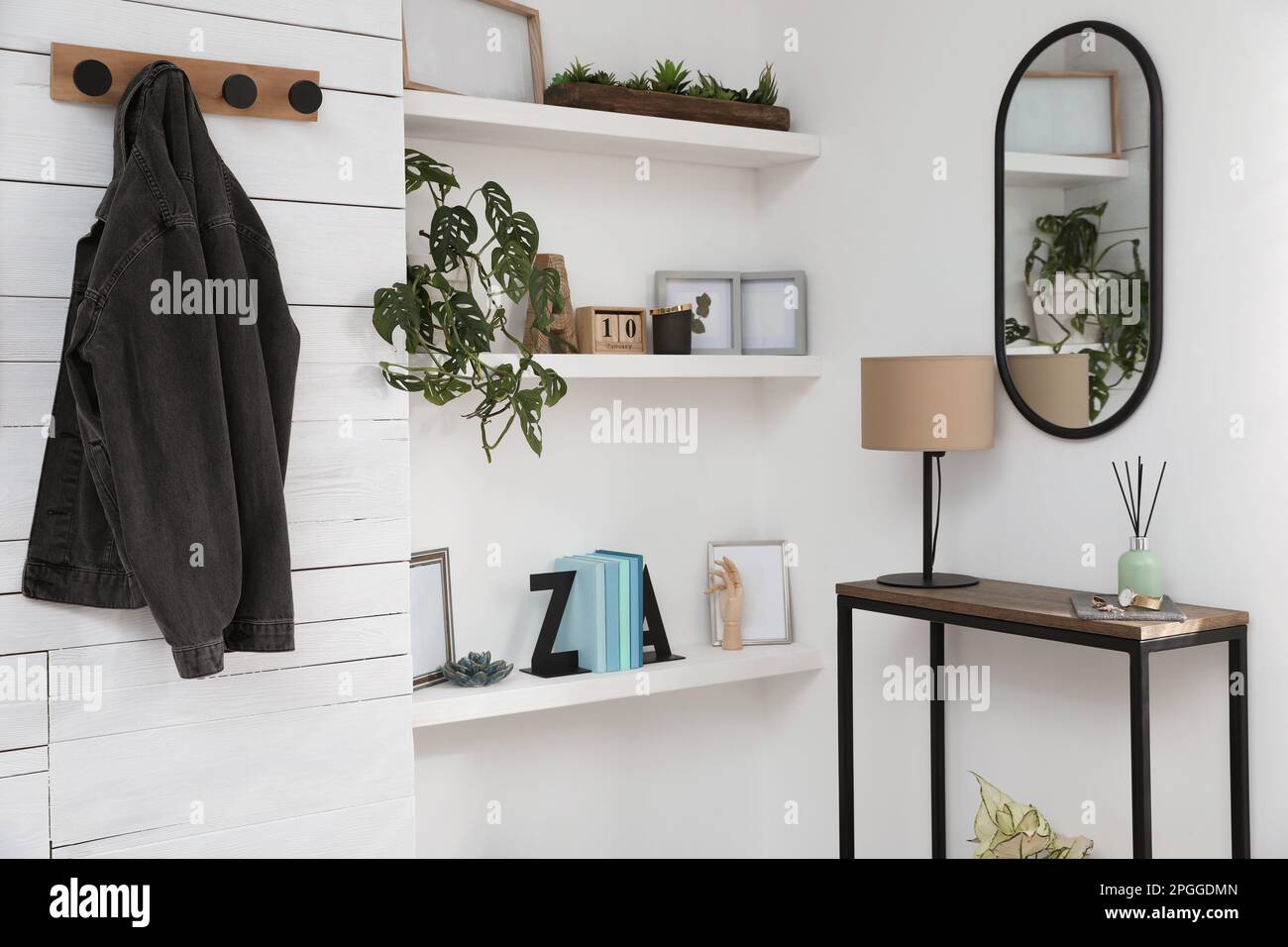Hallway interior with console table and stylish decor Stock Photo - Alamy