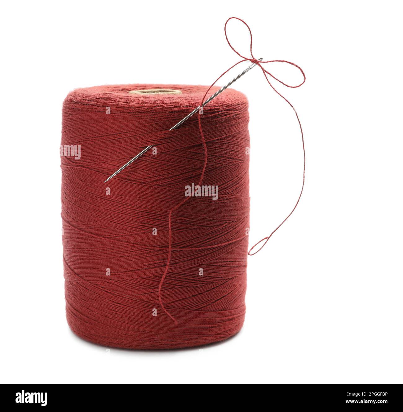 Red sewing thread with needle on white background Stock Photo Alamy