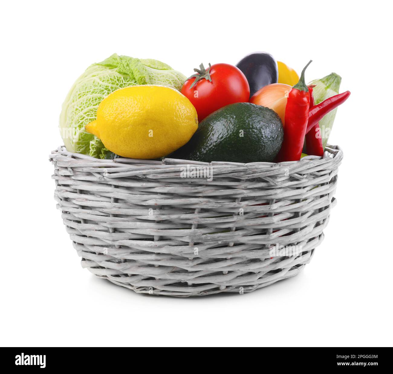 Wicker basket with fresh ripe vegetables and fruit on white background ...