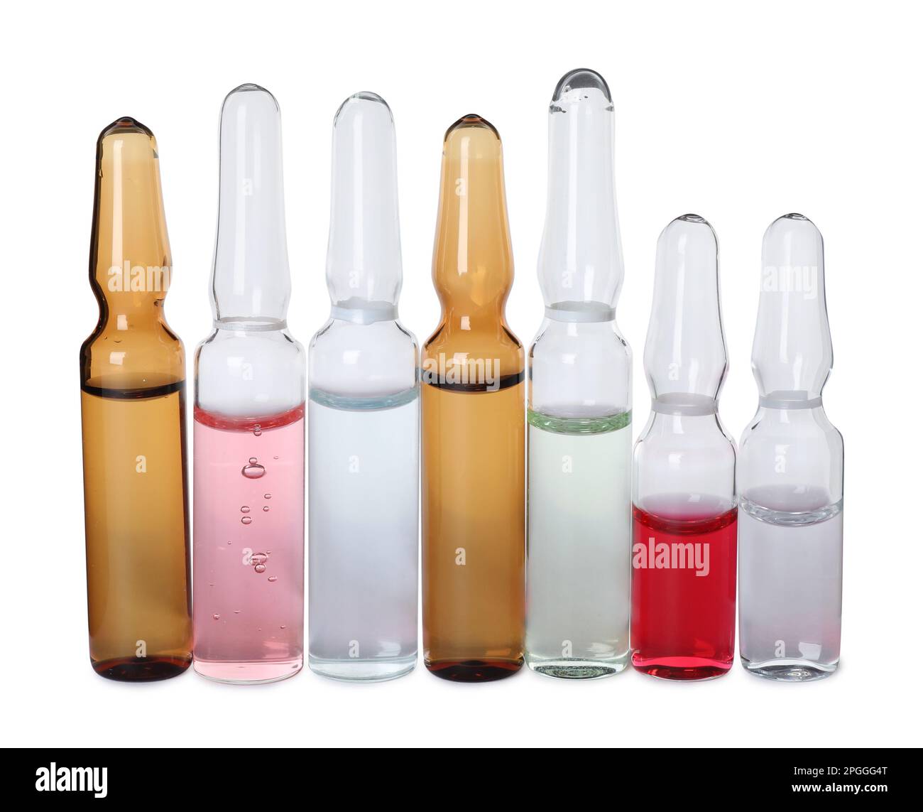 Glass ampoules with pharmaceutical products on white background Stock