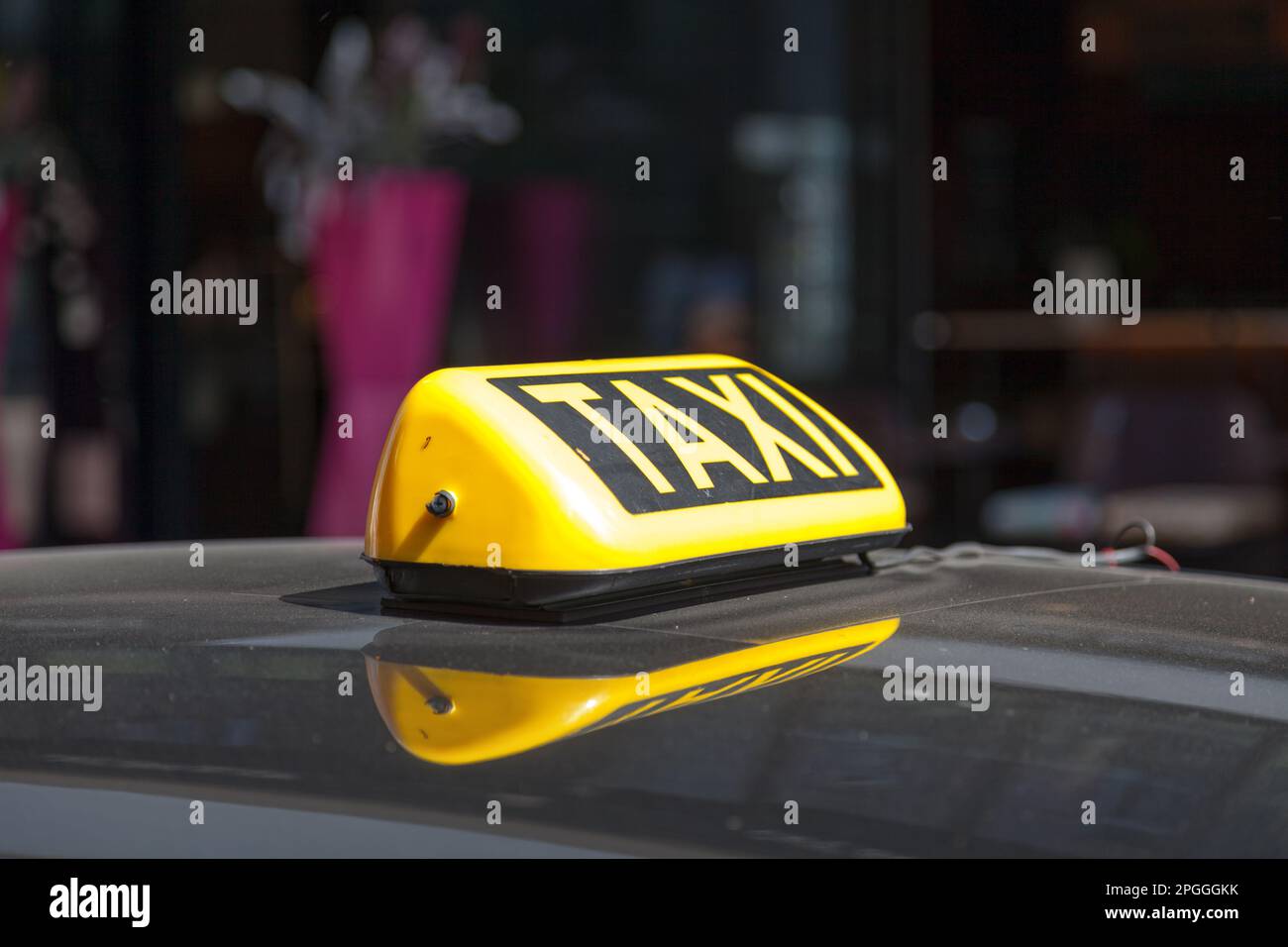 Close-up on a yellow Austrian taxi sign from Vienna. Stock Photo