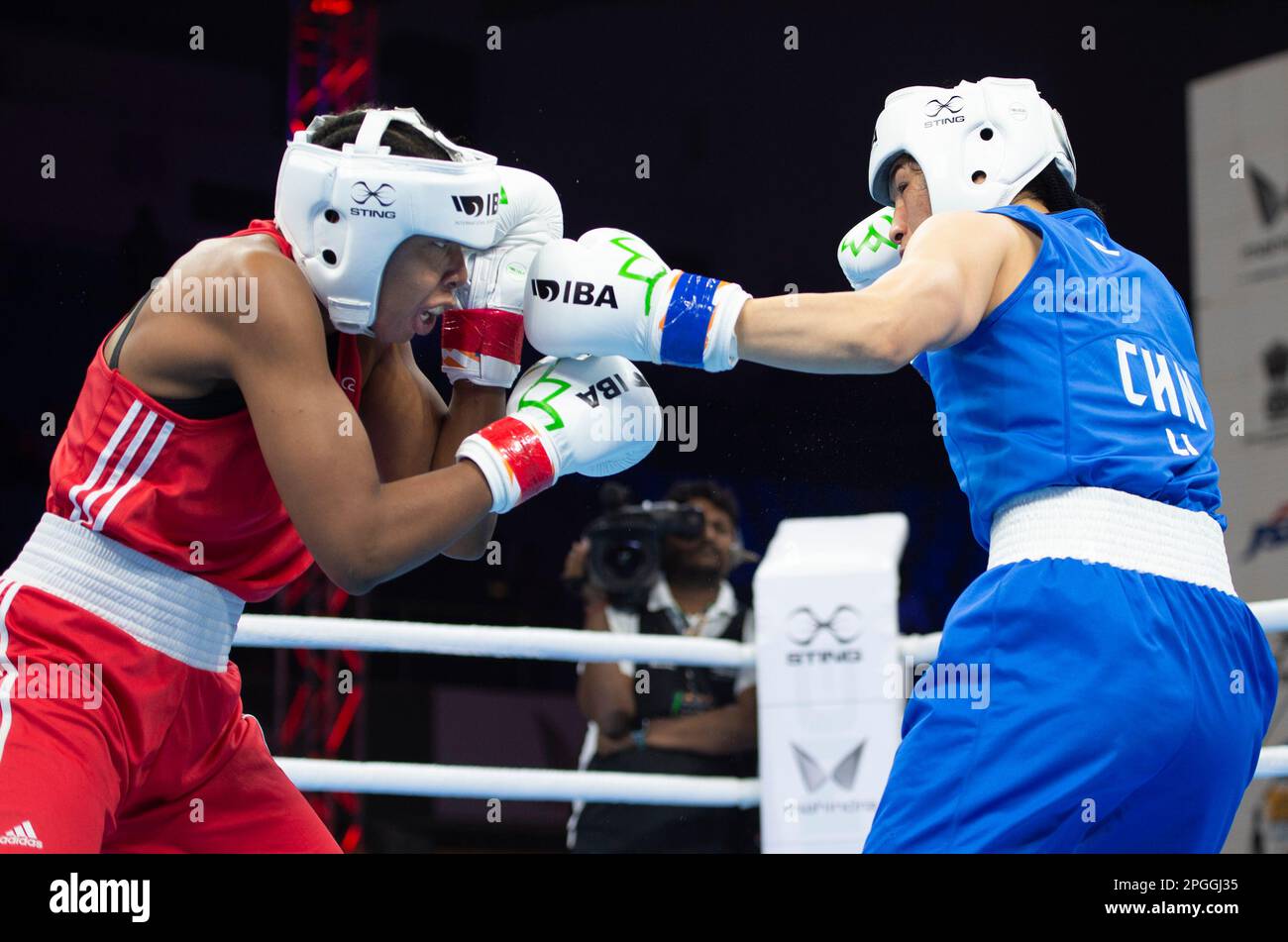 Li Quan Boxing New Delhi, India. 22nd Mar, 2023. China's Li Qian (R) competes with ...