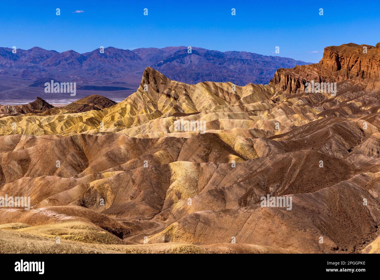 This is a view of the sandstone 'badlands' from Zabriskie Point at Death Valley National Park, California, USA. Manly Beacon is just left of center. Stock Photo