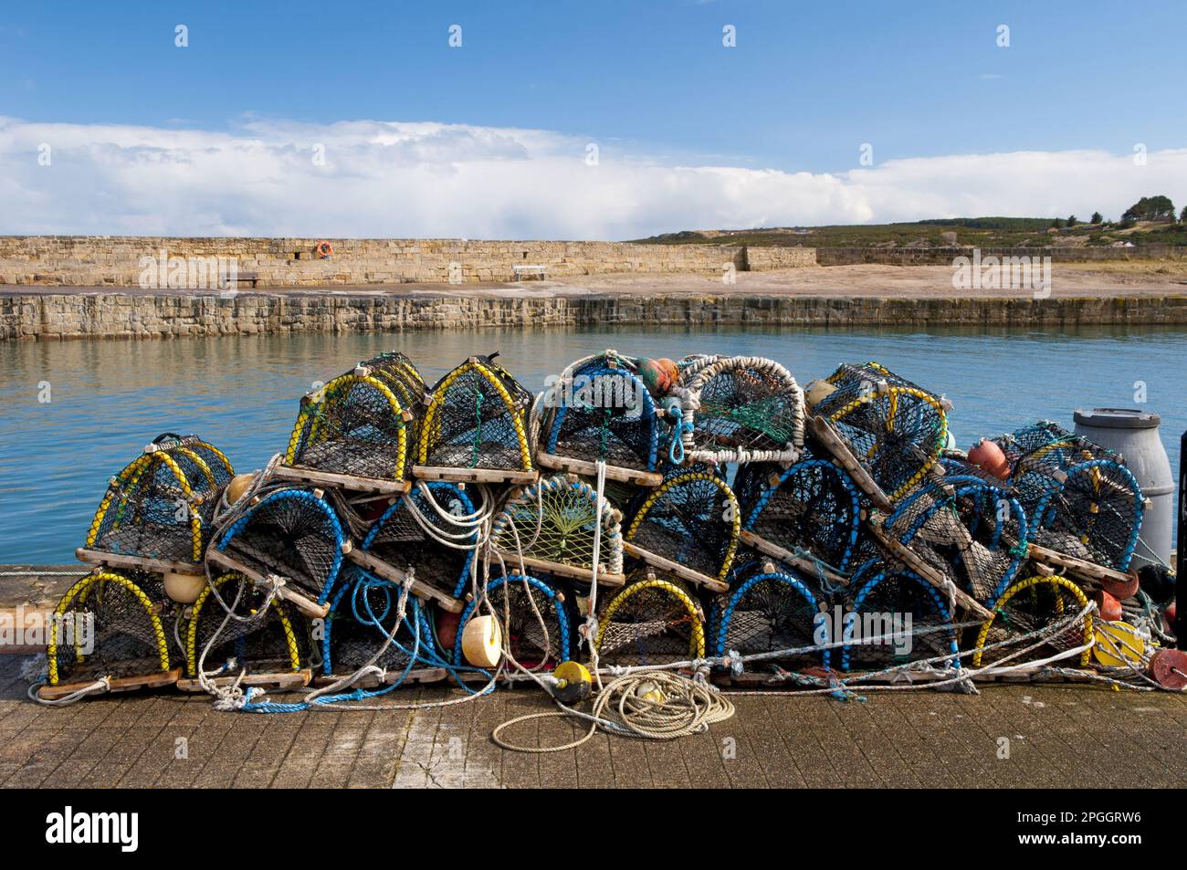 Pile of lobster pots stacked on quayside, Hopeman Harbour, Morayshire, Scotland, United Kingdom