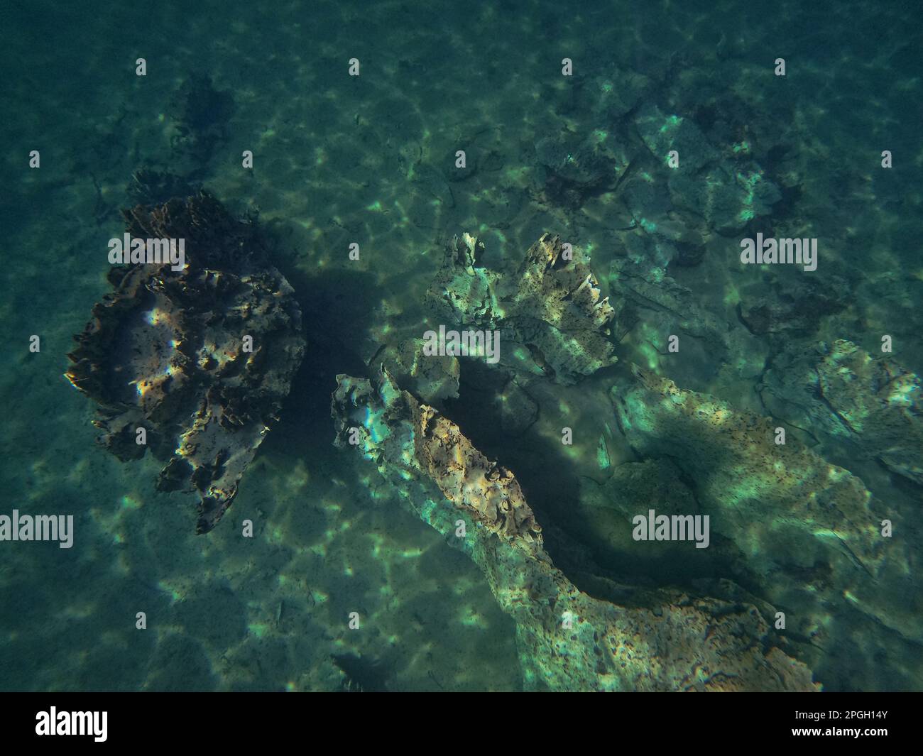 A rough rock below the water in Coron, Palawan in the Philippines with ...