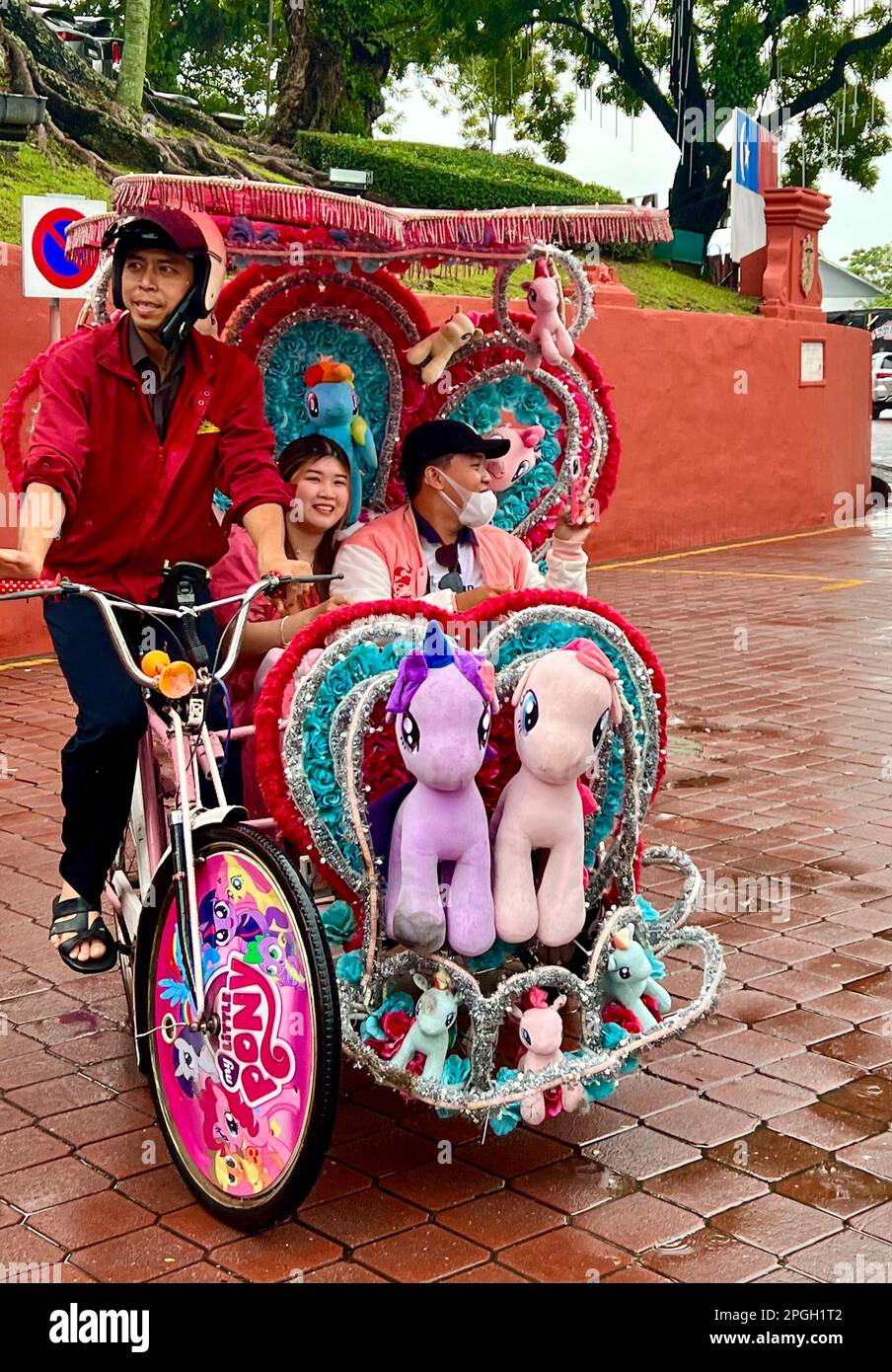 Malakka, Malaysia. 05th Mar, 2023. A rickshaw driver takes tourists on a city tour in his richly decorated vehicle on the theme of 'My Little Pony'. The World Heritage Site on the southwest coast of Malaysia is home to what must be the world's most insane rickshaws. Tourists can explore the city's colonial history amid a frenzy of stuffed animals and plastic roses. (to dpa 'The world's craziest rickshaws: With Hello Kitty through Malacca ') Credit: Carola Frentzen/dpa/Alamy Live News Stock Photo