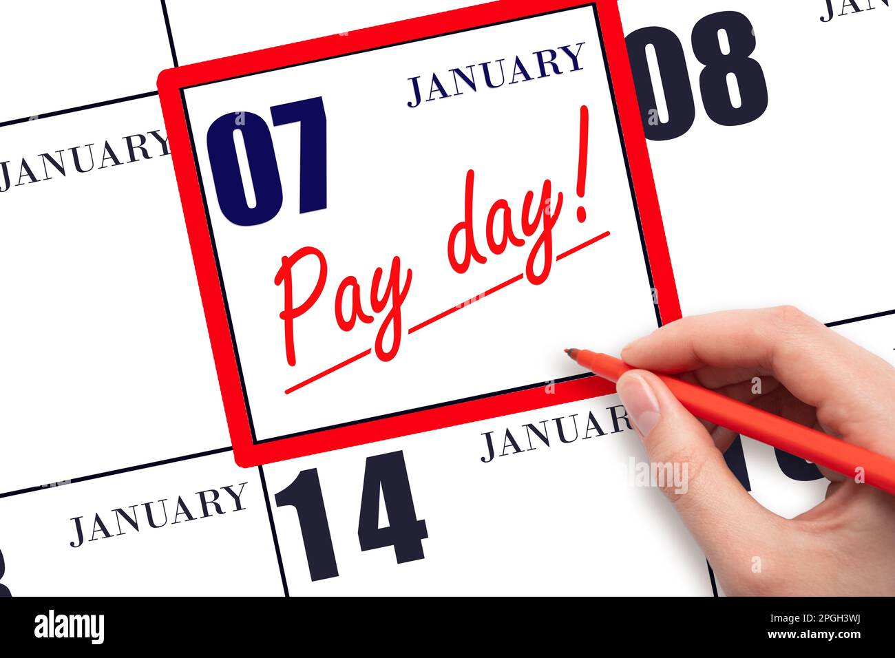 7th day of January. Hand writing text PAY DATE on calendar date January 7 and underline it. Payment due date. Reminder concept of payment. Winter mont Stock Photo