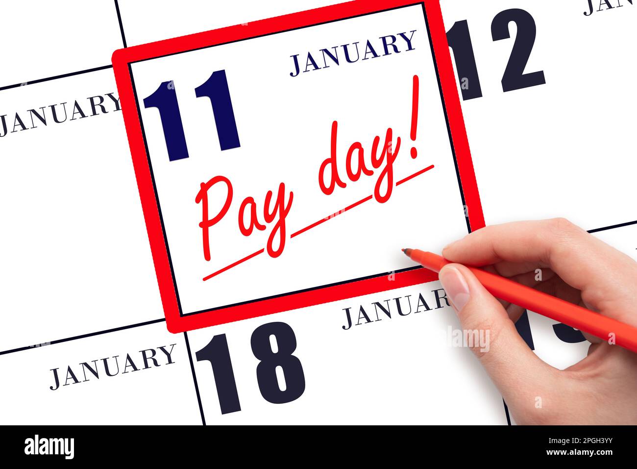 11th day of January. Hand writing text PAY DATE on calendar date January 11 and underline it. Payment due date. Reminder concept of payment. Winter mo Stock Photo