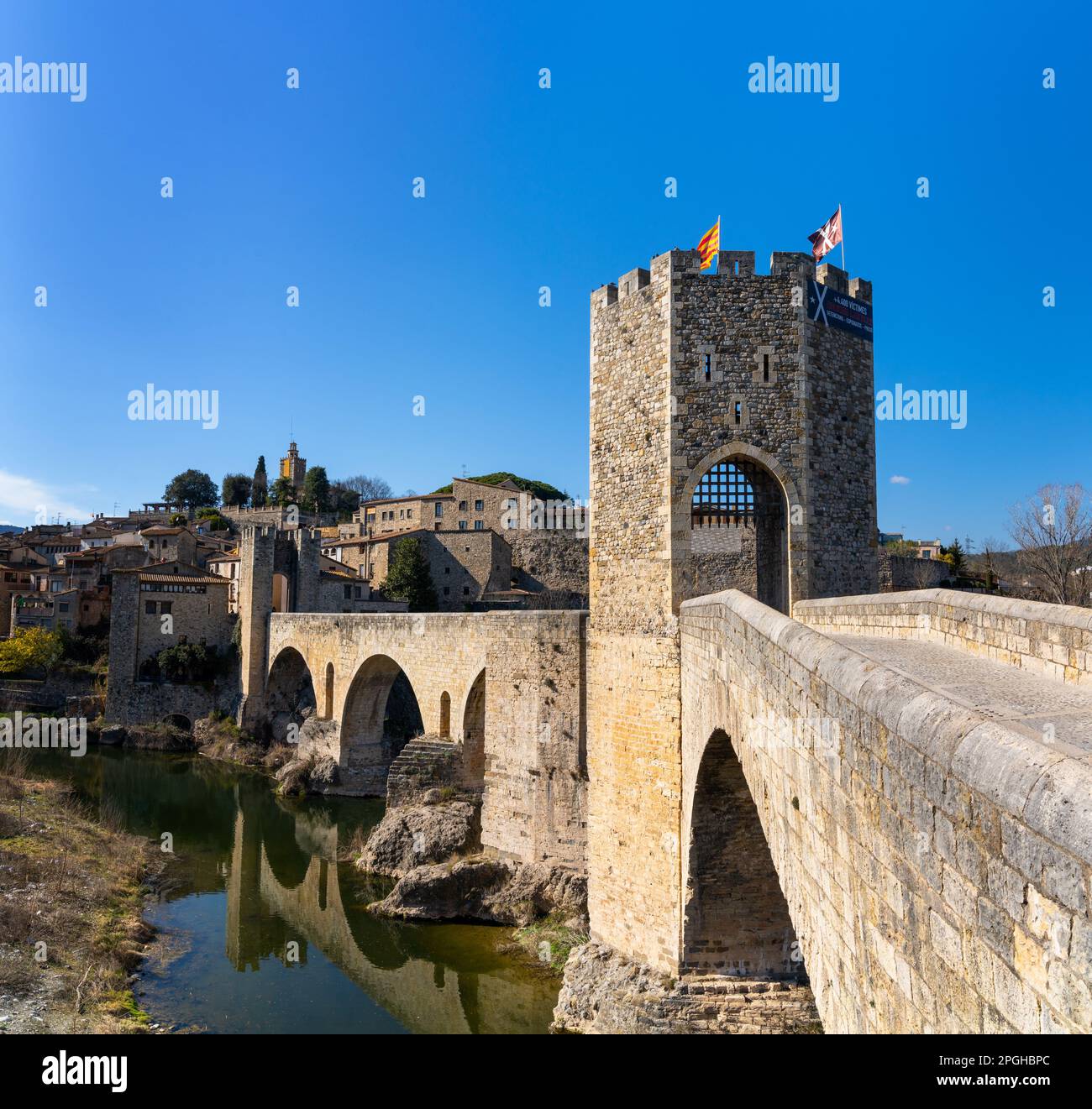 Besalu, Spain - 1 March, 2023: view of the medieval Romanesque bridge and village of Besalu in Catalonia Stock Photo