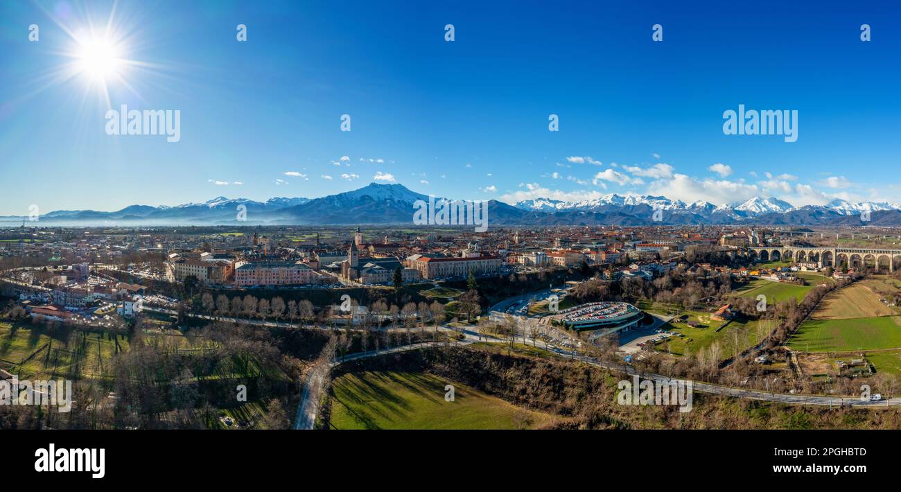 Cuneo, Italy: 10 March, 2023: panorama drone view of Cuneo in the Itlaian Piedmont with snow-capped mountains behind Stock Photo