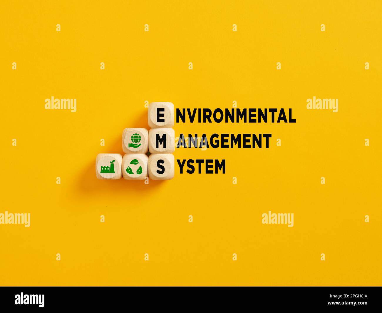 The acronym EMS and Environmental Management Syatem text on wooden