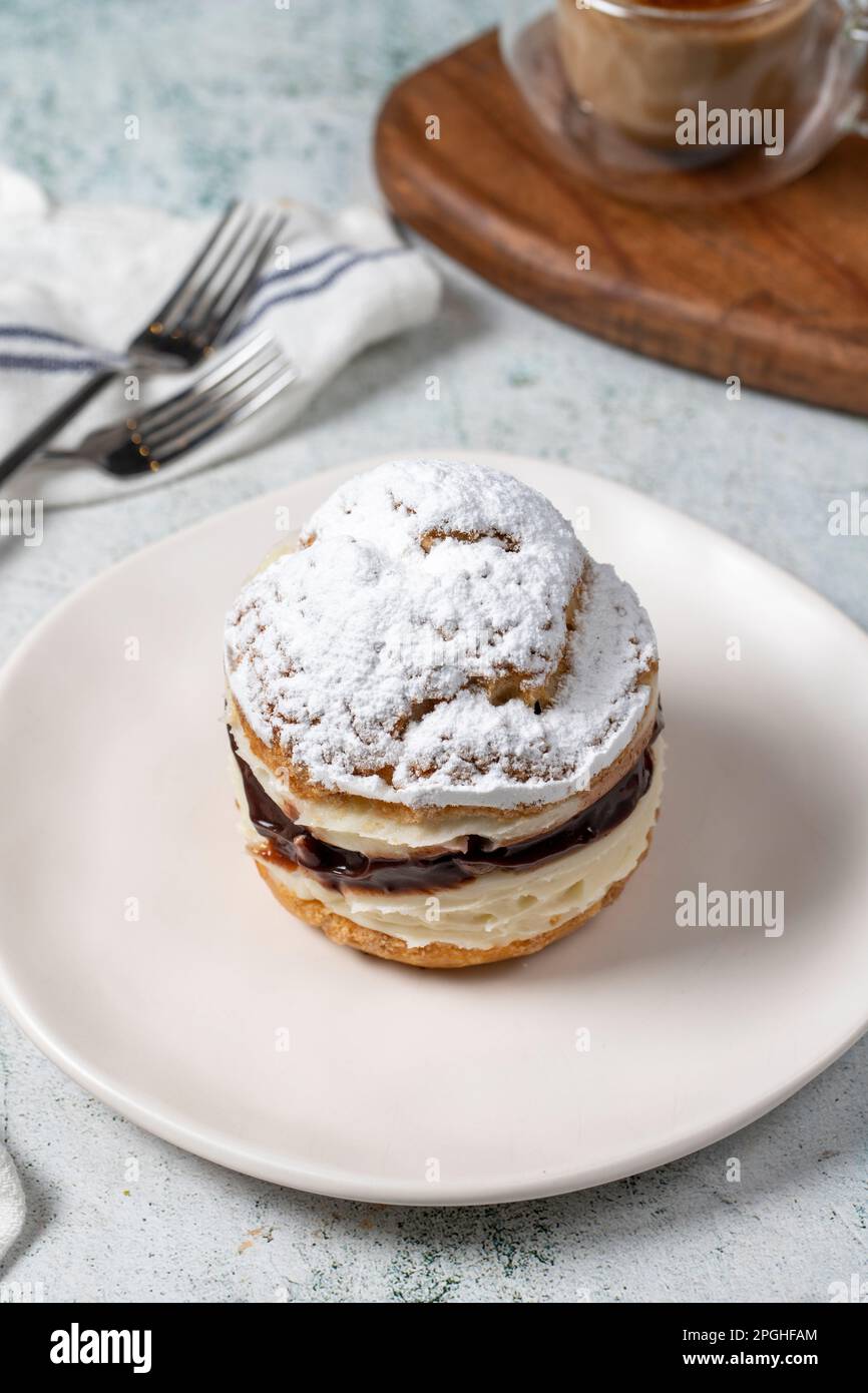 Cake with cream and liquid chocolate filling. Powdered Sugar Cake Stock