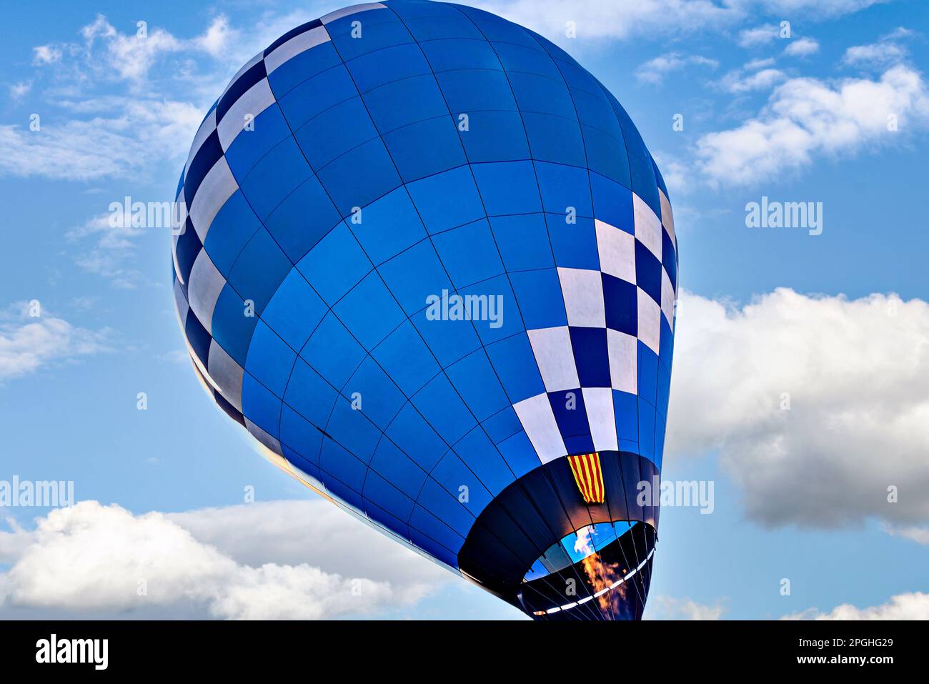 Blue hot air balloon flying on the blue sky with white clouds Stock ...