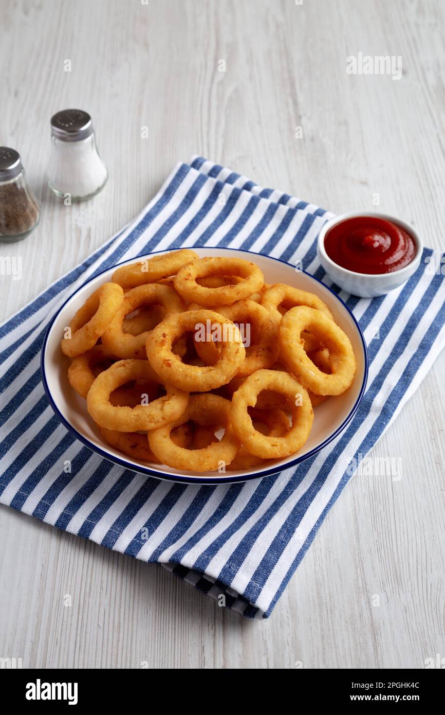 Homemade Breaded Onion Rings with Ketchup on a Plate, side view Stock