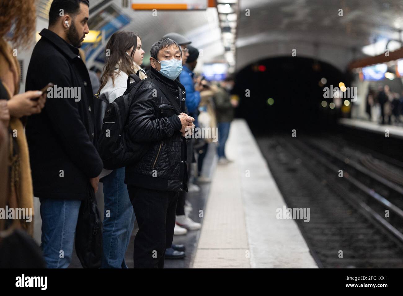 Paris, France. 23rd Mar, 2023. People wait for the train at the gare du