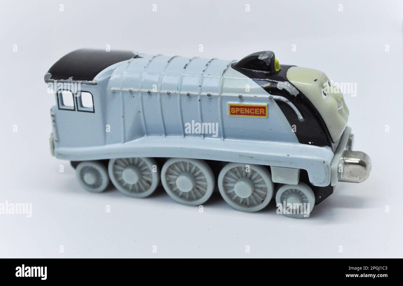 A die cast model of Spencer from the Thomas the Tank Engine series set against a white background Stock Photo