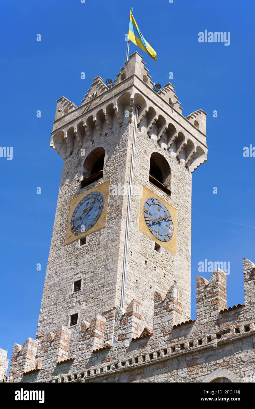 The civic tower of Trento stands in the main square of the town, Piazza Duomo. This 43 metres high limestone tower was built in 1150 to defend the tow Stock Photo