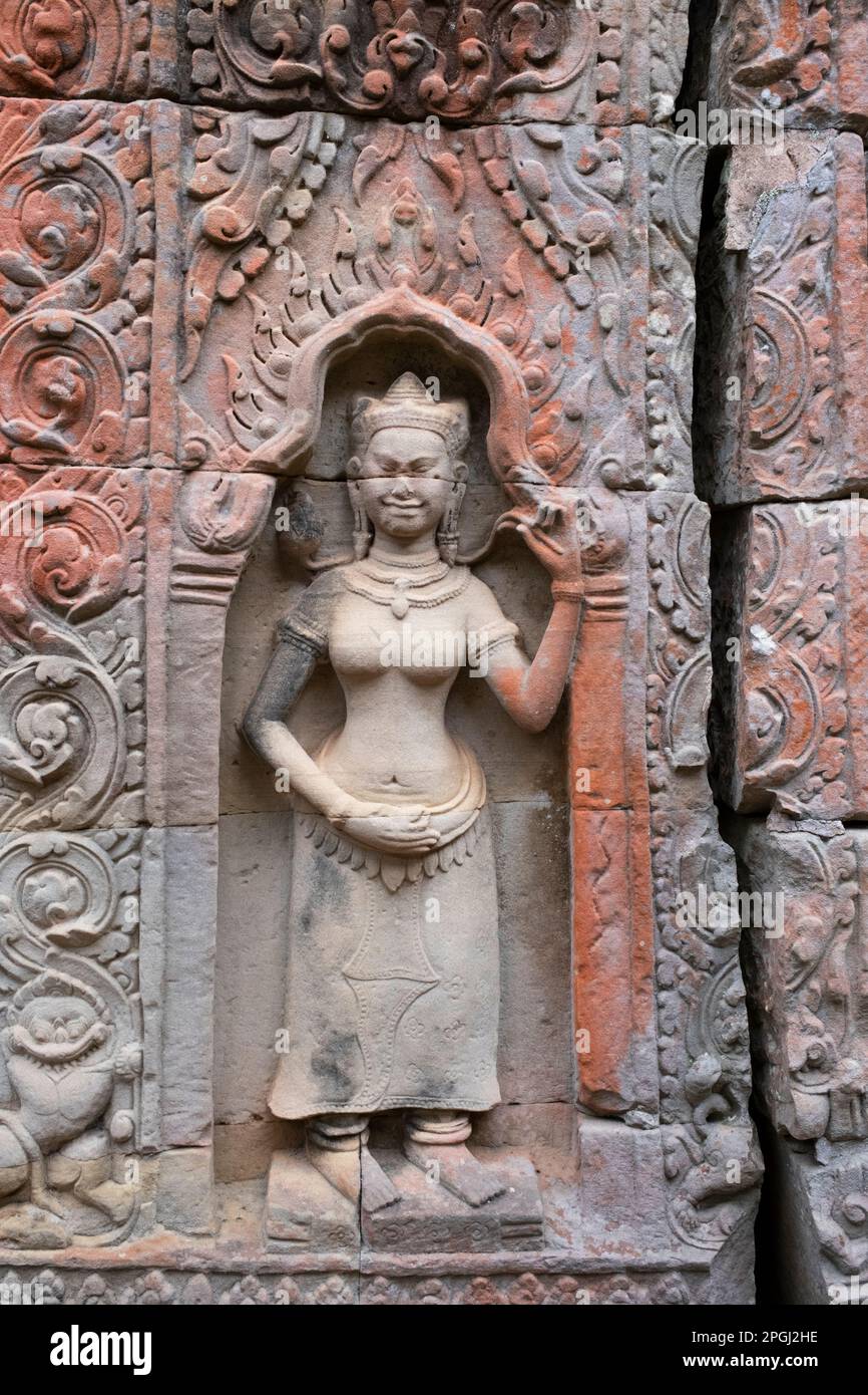 Cambodia: Devata (female deity), Preah Khan (Temple of the Sacred Sword). Preah Khan was built in the late 12th century (1191) by Jayavarman VII and is located just north of Angkor Thom. The temple was built on the site of Jayavarman VII's victory over the invading Chams in 1191. It was the centre of a substantial organisation, with almost 100,000 officials and servants. It served as a Buddhist university at one time. The temple's primary deity is the boddhisatva Avalokiteshvara in the form of Jayavarman's father. Stock Photo