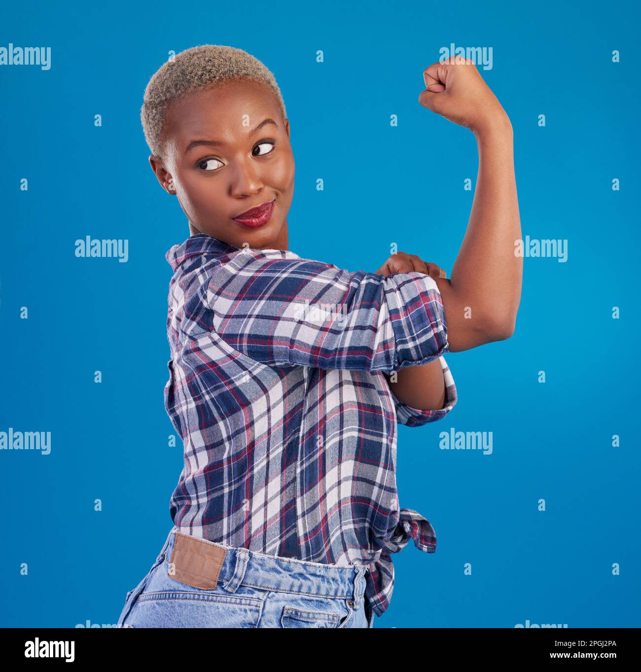 Young black woman flex arms in studio, blue background and backdrop of  freedom, empowerment or pride. Female model, bicep and girl power in fight  for Stock Photo - Alamy