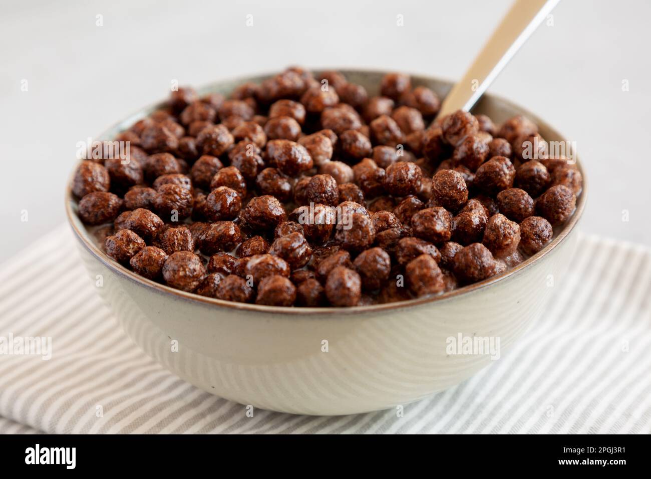Chocolate Puff Cereal with Milk in a Bowl, side view Stock Photo Alamy