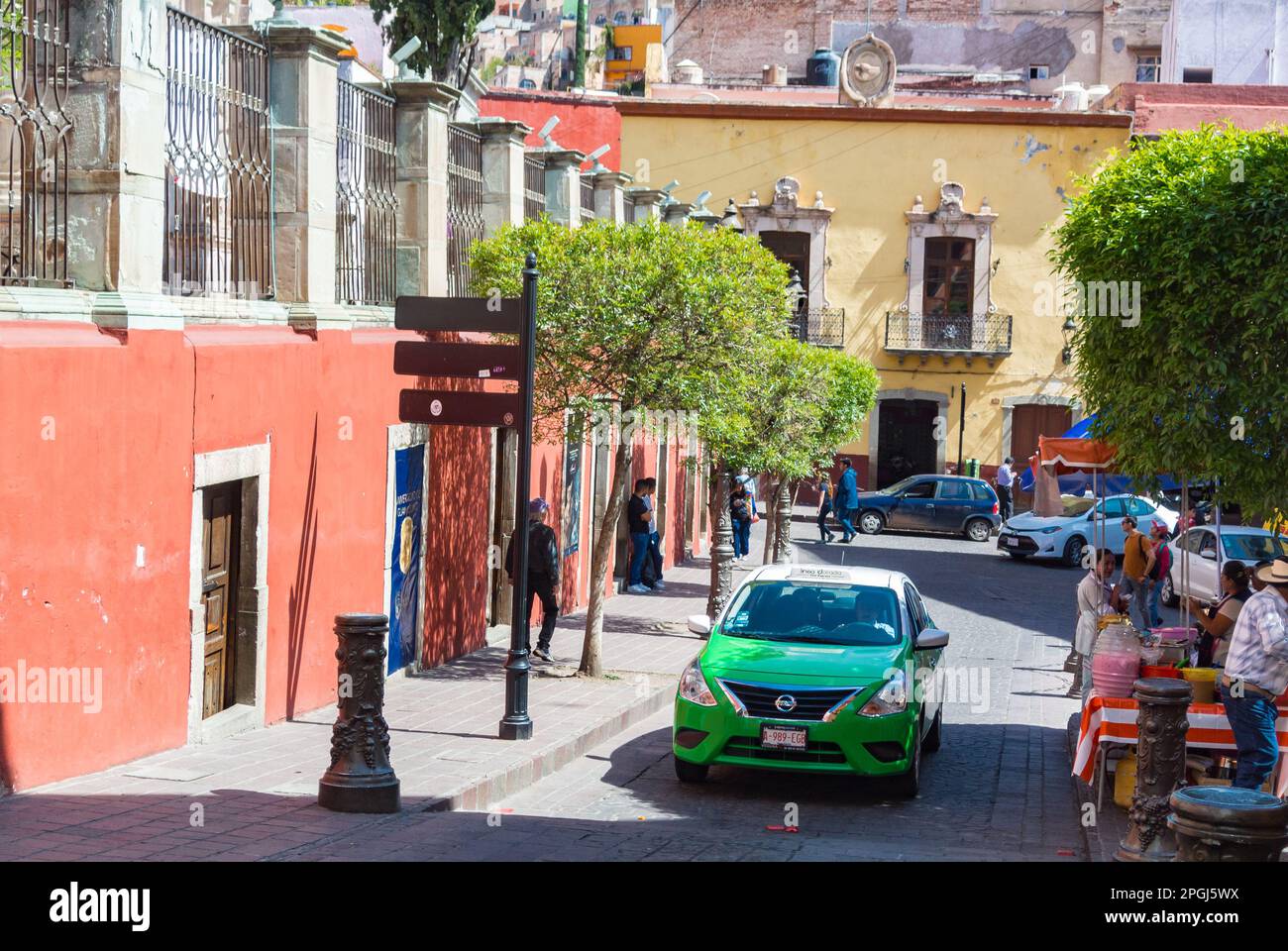 Guanajuato, Guanajuato, Mexico, Street scene with a green car in old