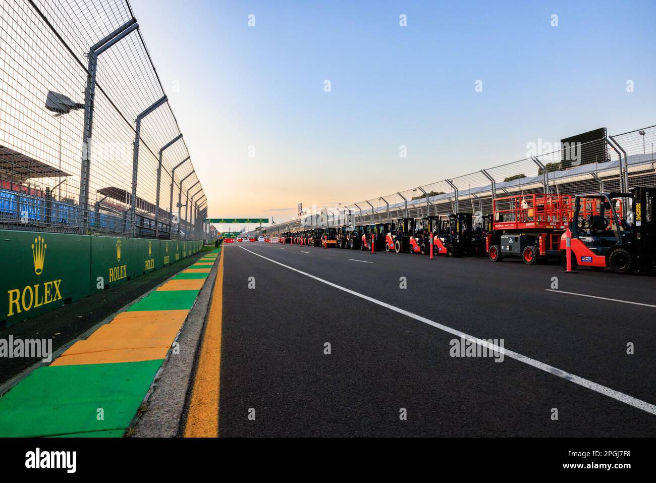 Albert Park, Melbourne. Thursday, Mar. 23, 2023.Forklifts line the final straight at the Albert Park Formula 1 Grand Prix street circuit during track preparations ahead of the event next week. credit: corleve/Alamy Live News Stock Photo
