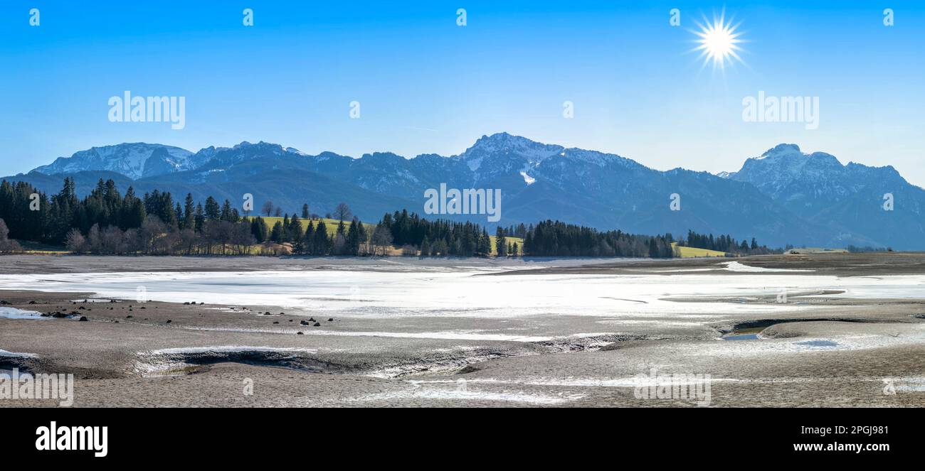 Forggensee without water, Ostallgaeu mountains in the background ...