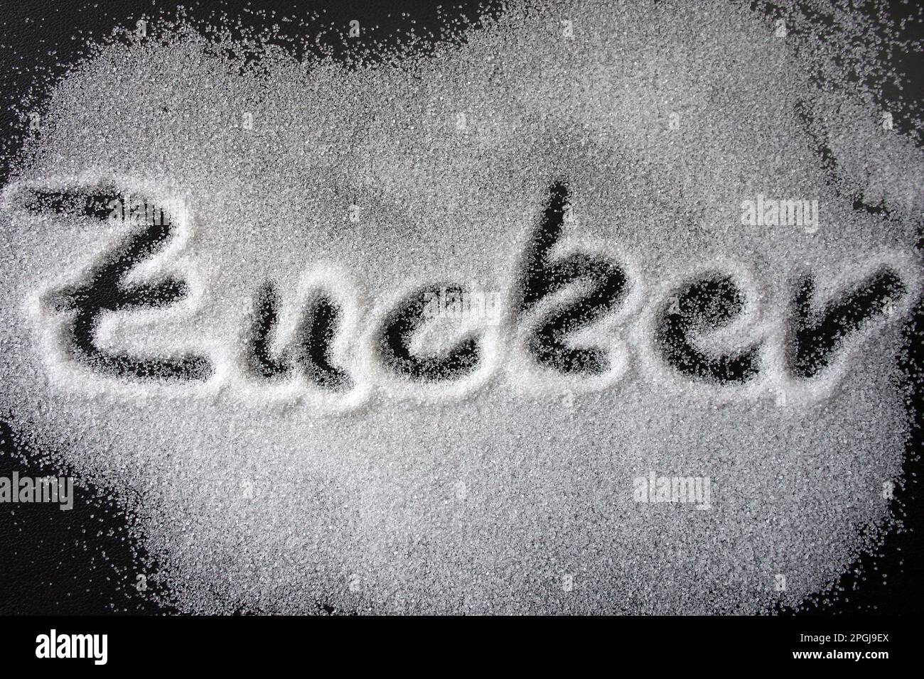the German word Zucker, sugar, written in sugar Stock Photo Alamy
