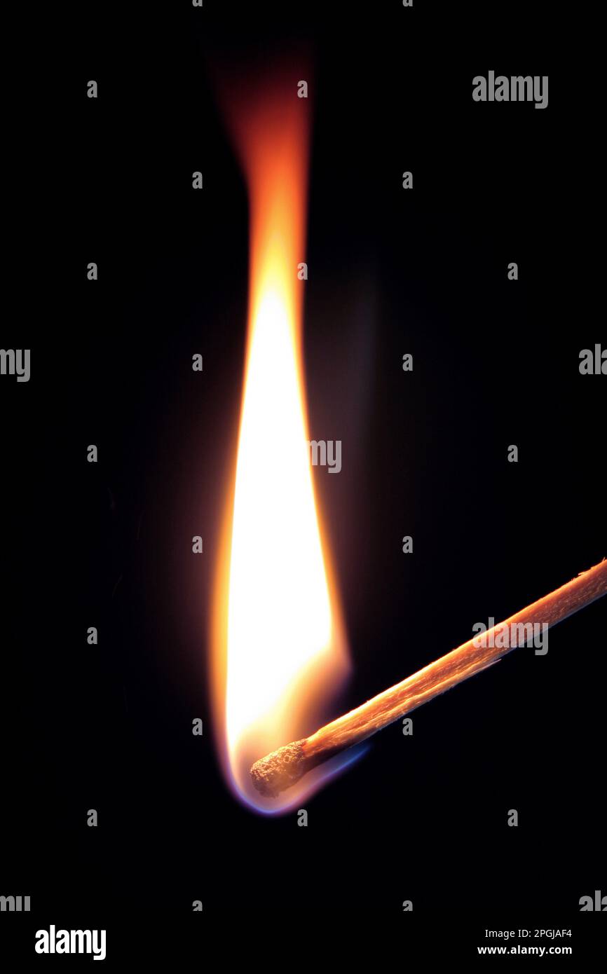 burning match against black background Stock Photo - Alamy