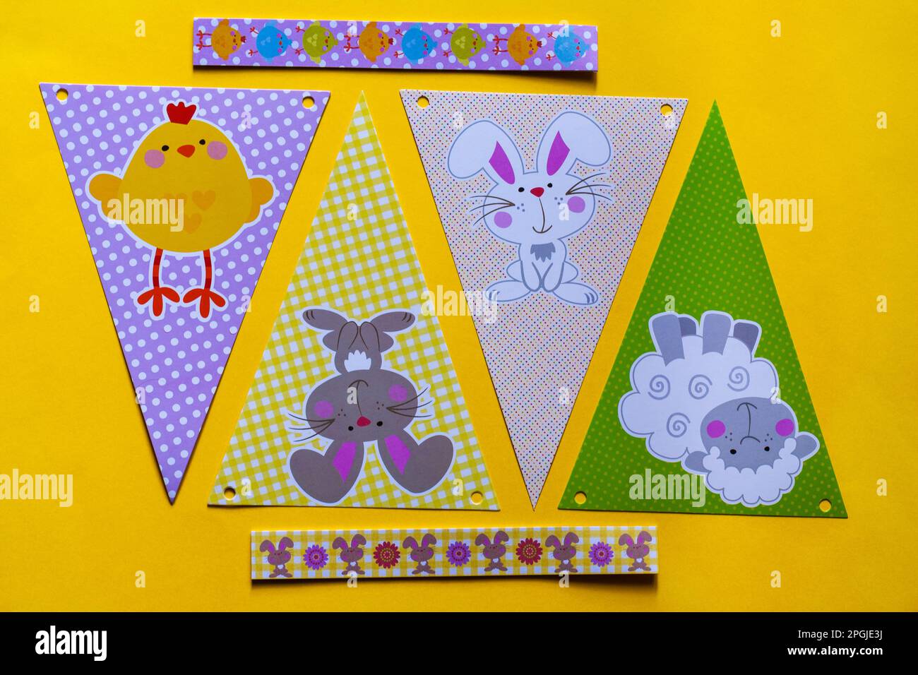 Happy Easter decorations, bunting on yellow background Stock Photo
