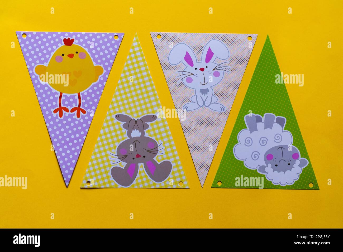 Happy Easter decorations, bunting on yellow background Stock Photo
