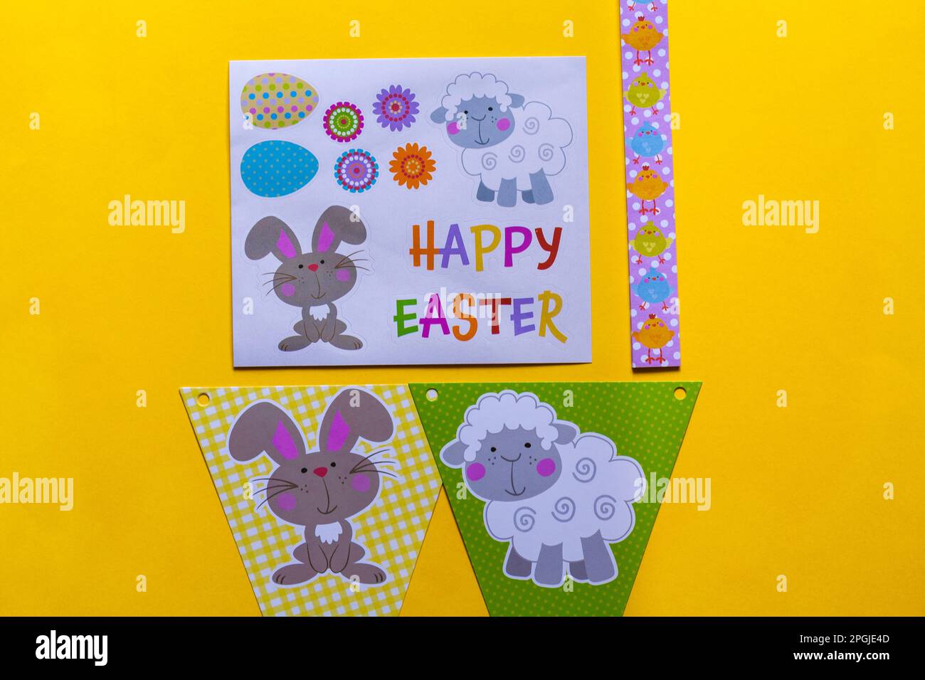 Happy Easter decorations, bunting on yellow background Stock Photo