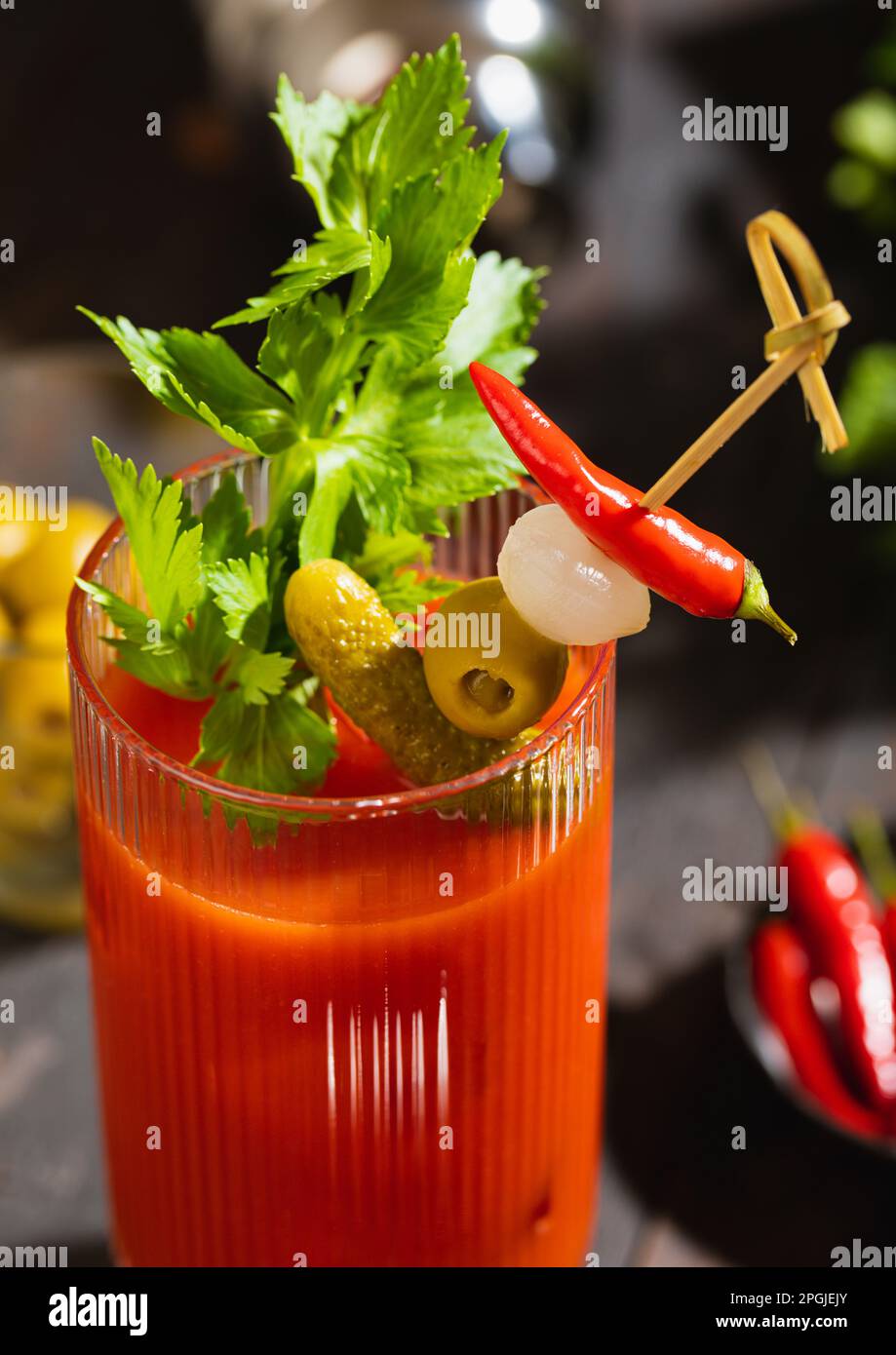 Cocktail bloody mary vodka and juice mix with peppers and celery on