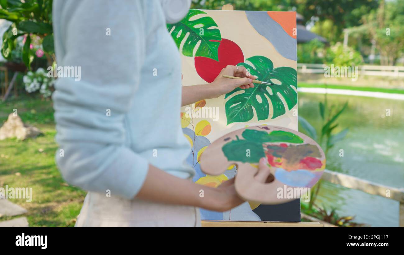 Artist concept, Female artist holding color palette and painting ...